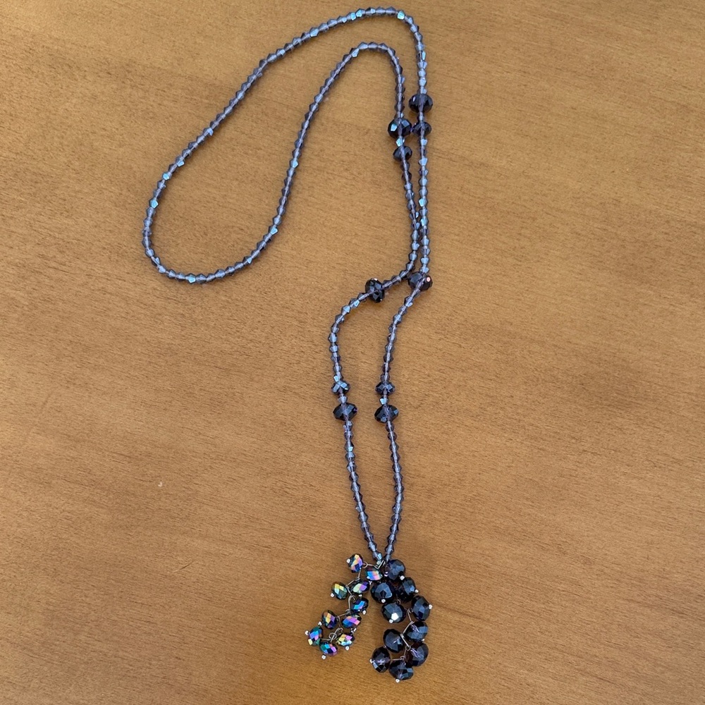 Purple and Iridescent Faceted Beaded Necklace with two pair of earrings.